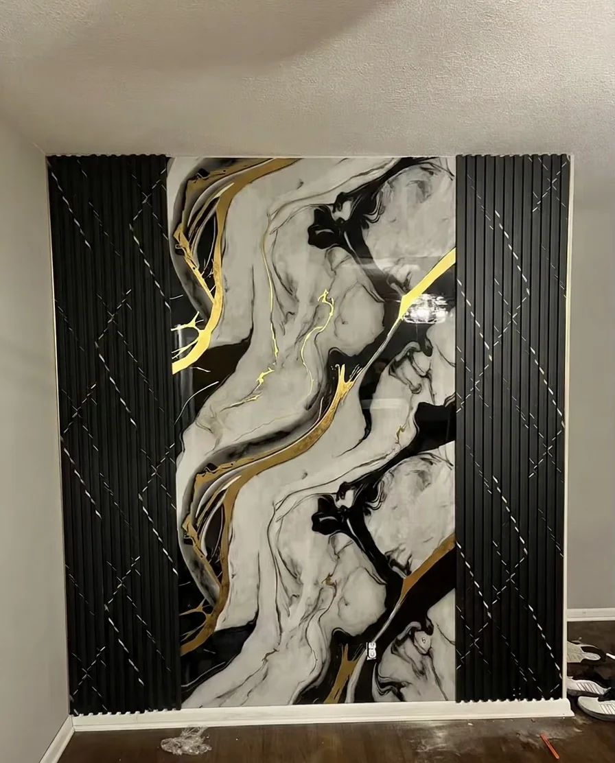 Black decorative wall panels with warm gold veining