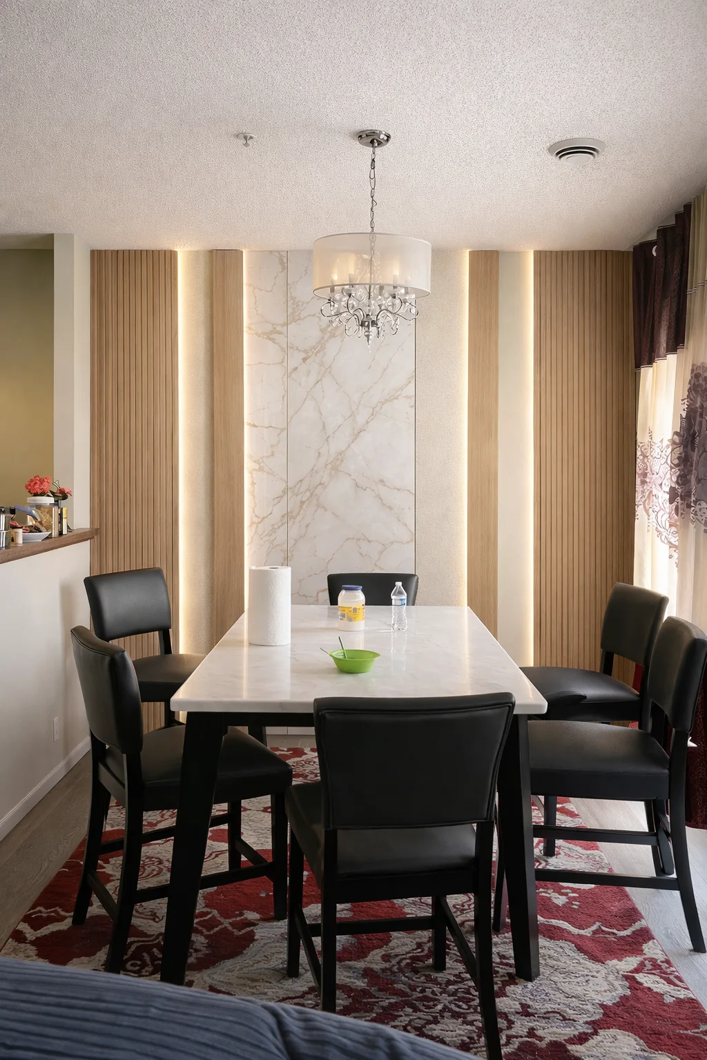 Dining room with decorative wall panels and vertical lighting